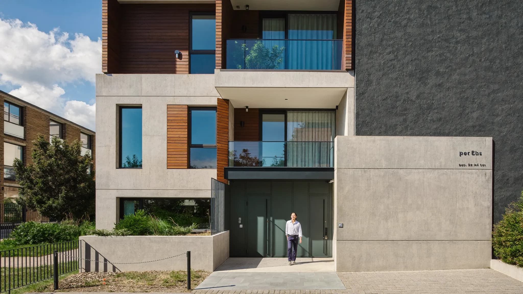 A first-time buyer couple standing in the living room of a new Shared Ownership apartment.